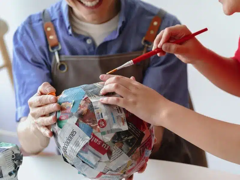 kids making a paper globe